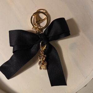 Elegant Black and Gold Keychain with Bow